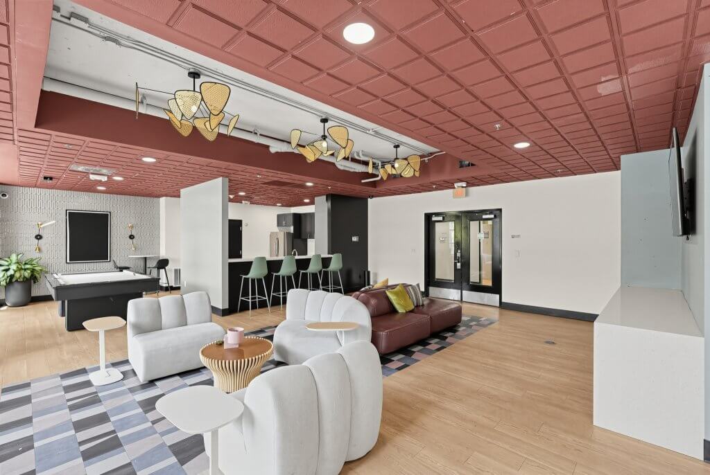 Community lounge with pool table and kitchen